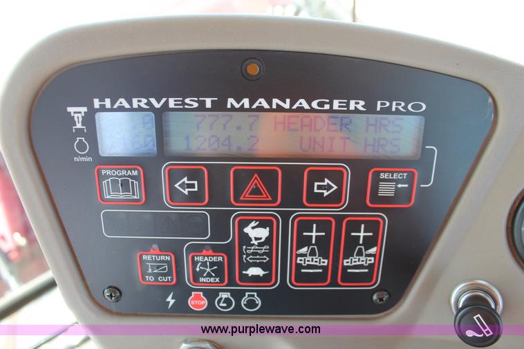 image for item H5859 2011 MacDon M205 self-propelled windrower