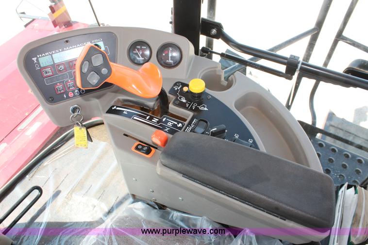 image for item H5859 2011 MacDon M205 self-propelled windrower