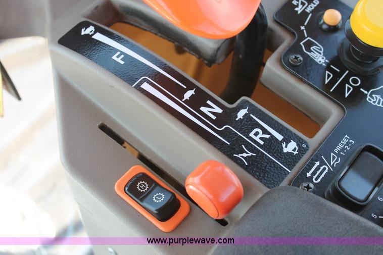 image for item H5859 2011 MacDon M205 self-propelled windrower