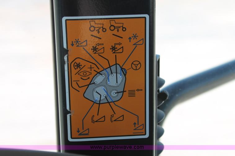 image for item H5859 2011 MacDon M205 self-propelled windrower