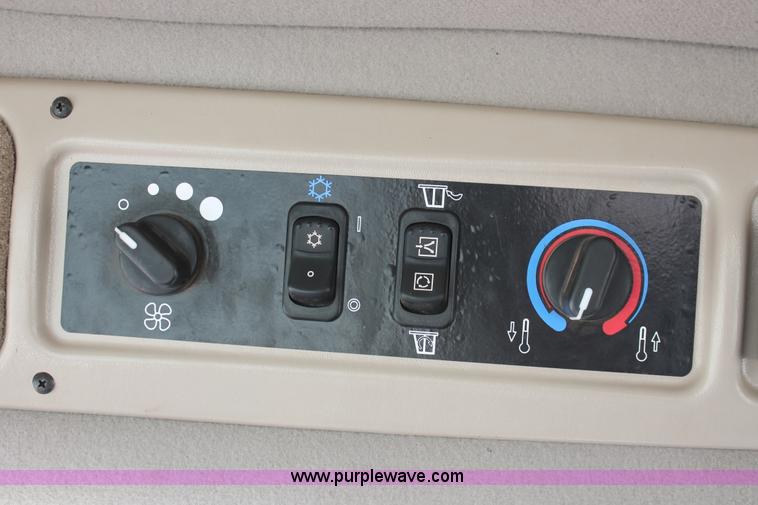 image for item H5859 2011 MacDon M205 self-propelled windrower