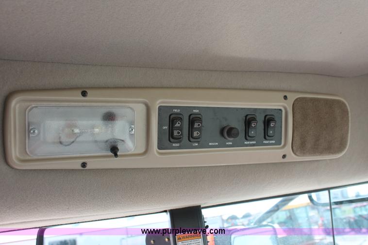 image for item H5859 2011 MacDon M205 self-propelled windrower