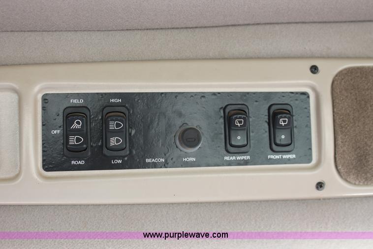 image for item H5859 2011 MacDon M205 self-propelled windrower