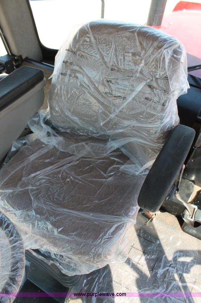 image for item H5859 2011 MacDon M205 self-propelled windrower