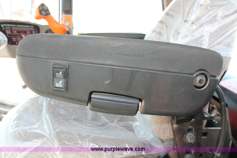 image for item H5859 2011 MacDon M205 self-propelled windrower