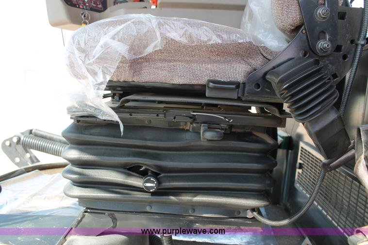 image for item H5859 2011 MacDon M205 self-propelled windrower