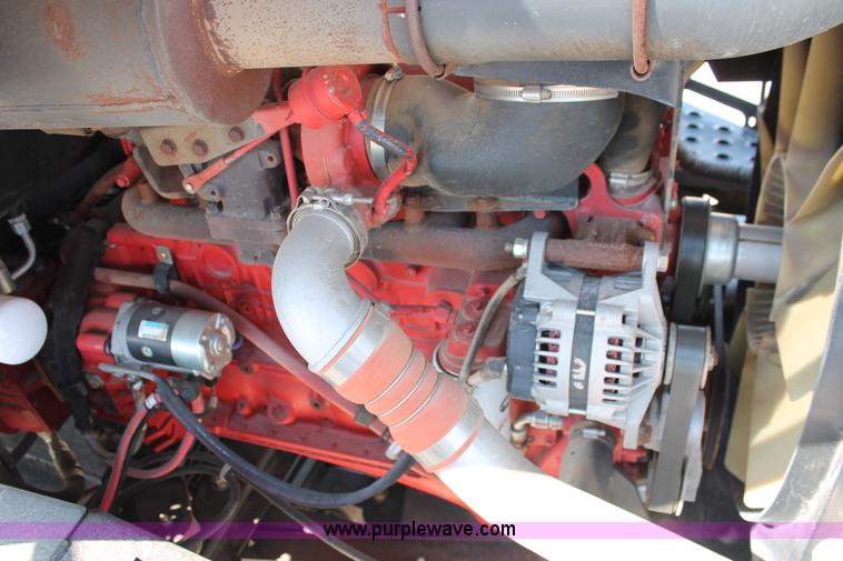 image for item H5859 2011 MacDon M205 self-propelled windrower