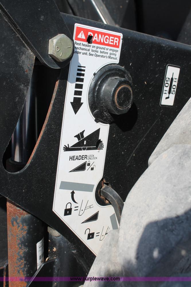 image for item H5859 2011 MacDon M205 self-propelled windrower