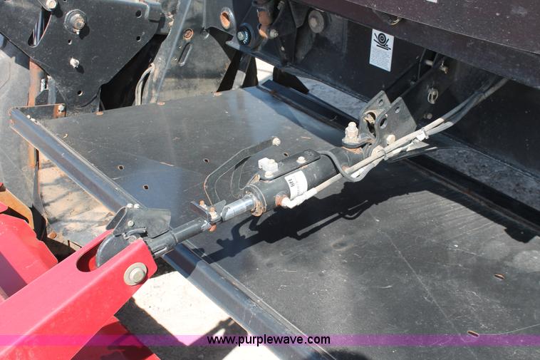 image for item H5859 2011 MacDon M205 self-propelled windrower