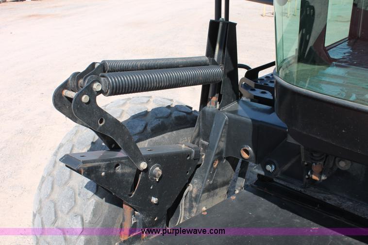 image for item H5859 2011 MacDon M205 self-propelled windrower