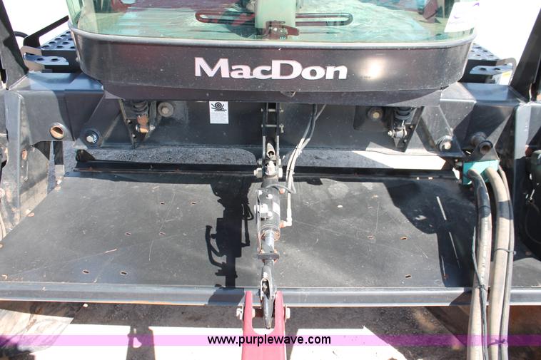 image for item H5859 2011 MacDon M205 self-propelled windrower