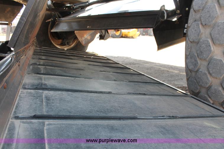 image for item H5859 2011 MacDon M205 self-propelled windrower