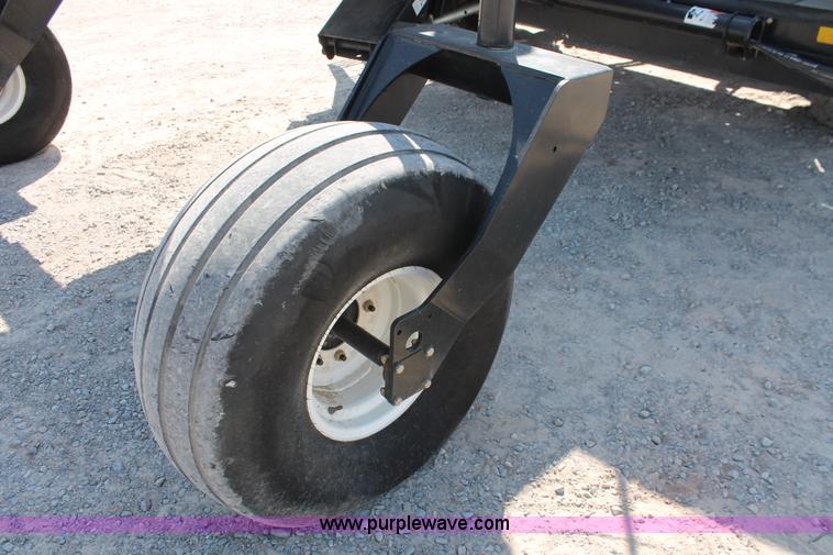 image for item H5859 2011 MacDon M205 self-propelled windrower