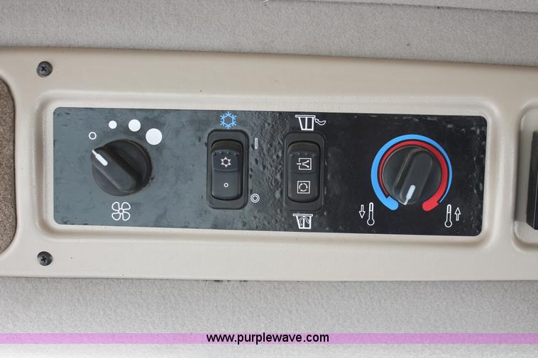 image for item H5860 2011 MacDon M205 self-propelled windrower