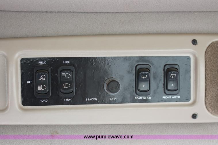 image for item H5860 2011 MacDon M205 self-propelled windrower