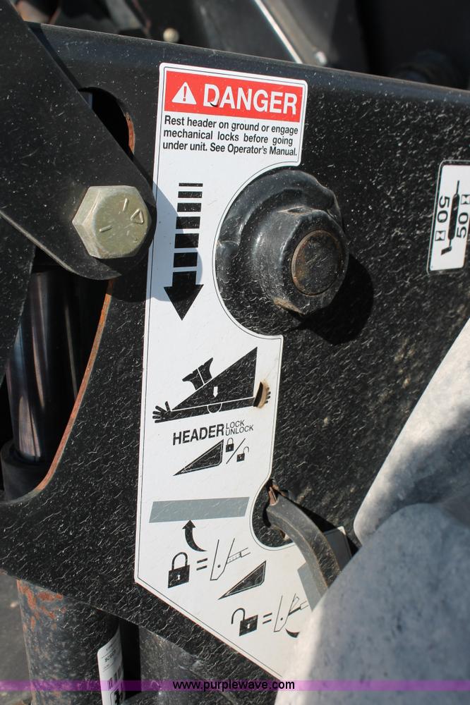 image for item H5860 2011 MacDon M205 self-propelled windrower