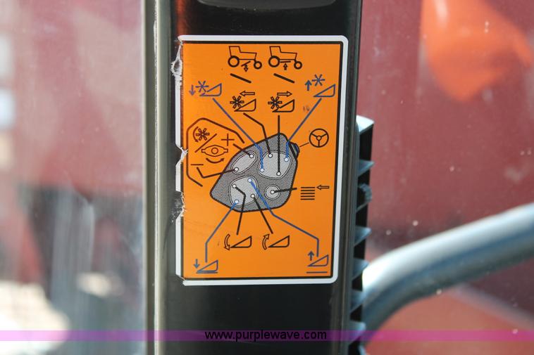 image for item H5861 2013 MacDon M205 self-propelled windrower