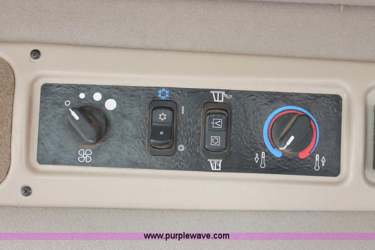 image for item H5861 2013 MacDon M205 self-propelled windrower