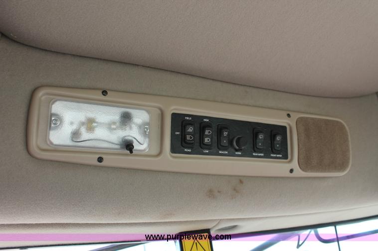 image for item H5861 2013 MacDon M205 self-propelled windrower