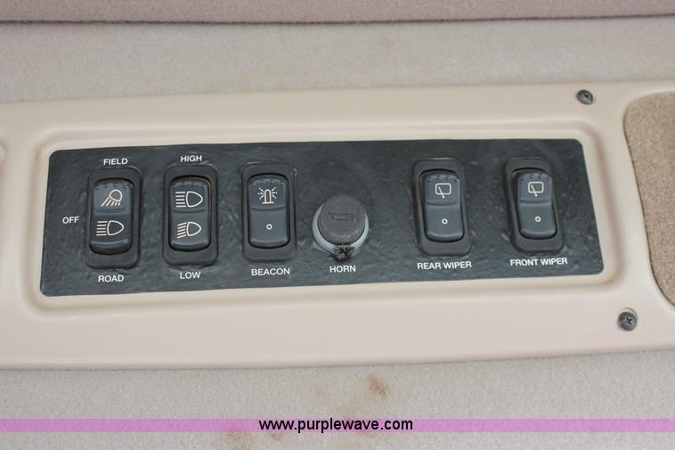 image for item H5861 2013 MacDon M205 self-propelled windrower