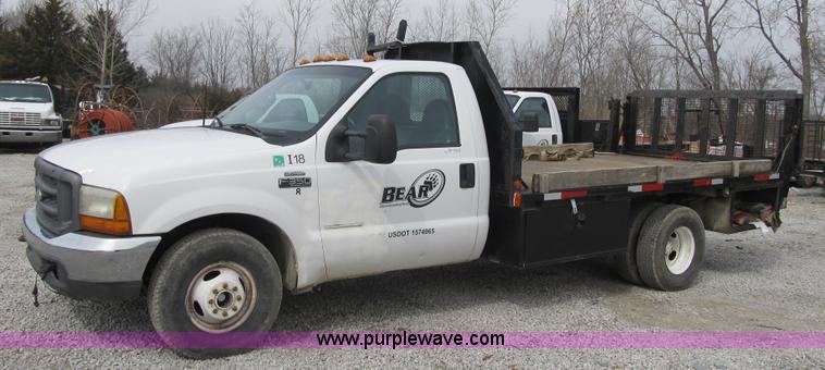 image for item AC9303 1999 Ford F350 Super Duty XL flatbed pickup truck