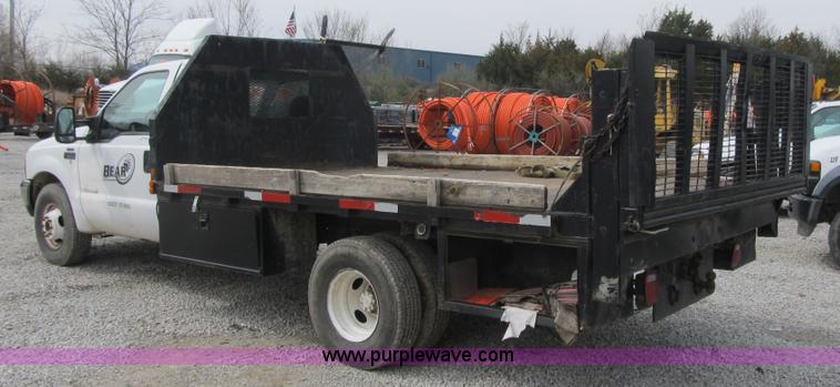 image for item AC9303 1999 Ford F350 Super Duty XL flatbed pickup truck