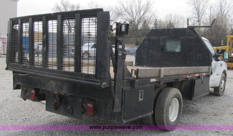 image for item AC9303 1999 Ford F350 Super Duty XL flatbed pickup truck