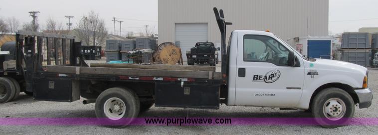 image for item AC9303 1999 Ford F350 Super Duty XL flatbed pickup truck