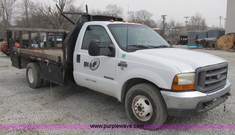 image for item AC9303 1999 Ford F350 Super Duty XL flatbed pickup truck