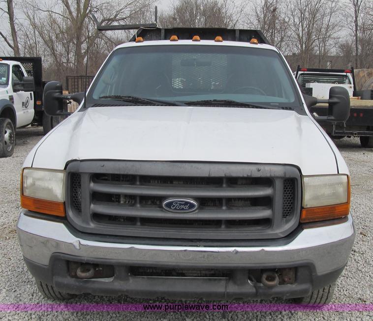 image for item AC9303 1999 Ford F350 Super Duty XL flatbed pickup truck