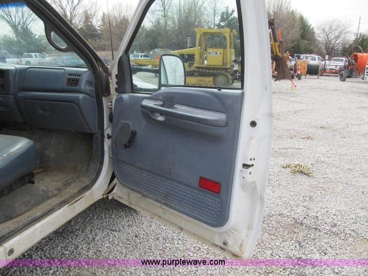 image for item AC9303 1999 Ford F350 Super Duty XL flatbed pickup truck