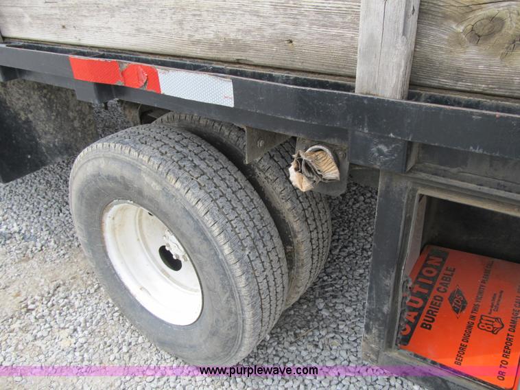 image for item AC9303 1999 Ford F350 Super Duty XL flatbed pickup truck