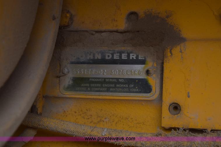image for item E6200 John Deere 772A motor grader