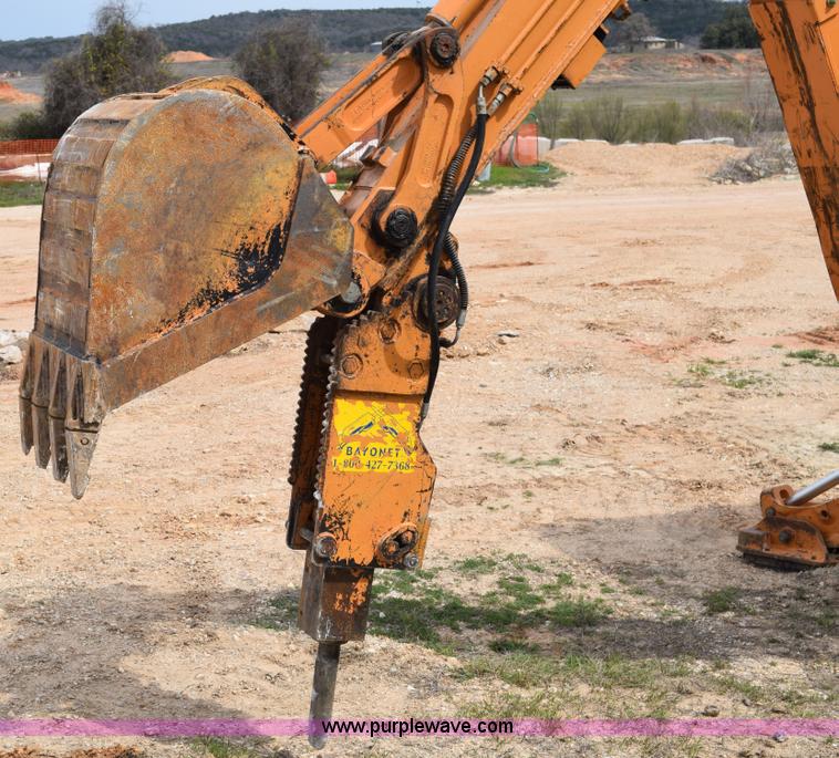 image for item E6289 2011 Case 580N backhoe with Bayonet Breaker