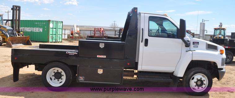 image for item F2349 2004 GMC C4500 flatbed truck