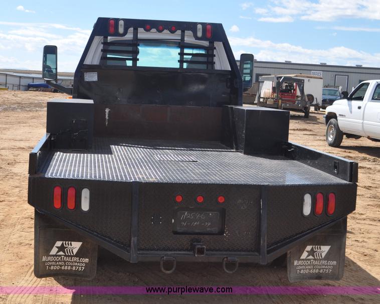 image for item F2349 2004 GMC C4500 flatbed truck