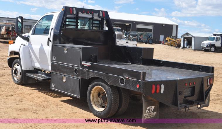 image for item F2349 2004 GMC C4500 flatbed truck