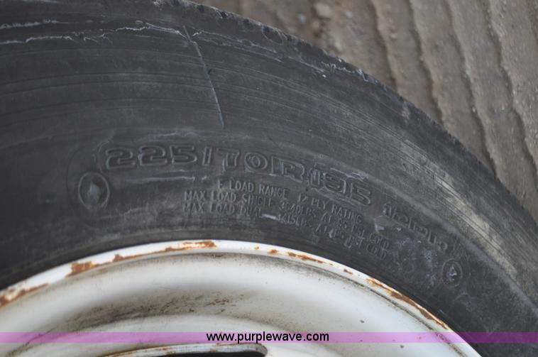 image for item F2349 2004 GMC C4500 flatbed truck