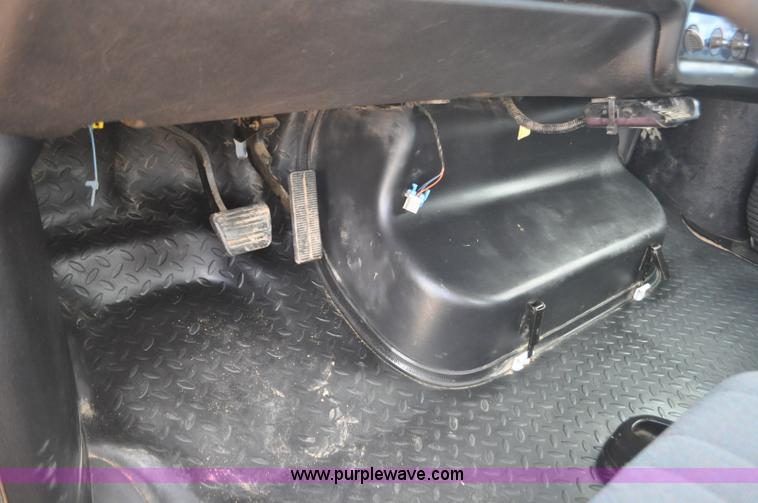 image for item F2349 2004 GMC C4500 flatbed truck