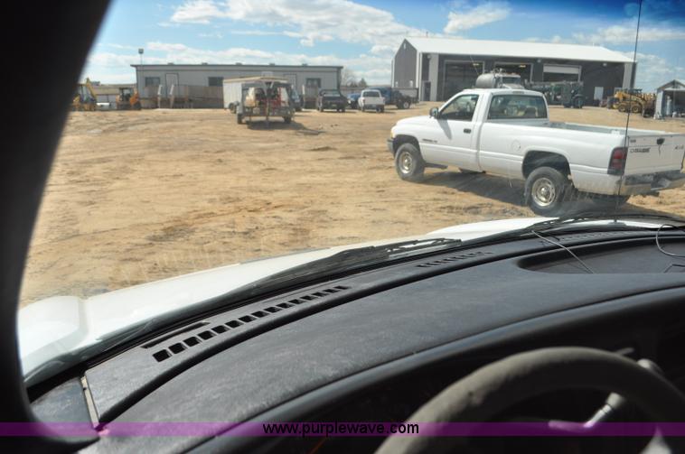 image for item F2349 2004 GMC C4500 flatbed truck