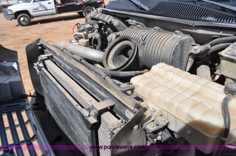 image for item F2349 2004 GMC C4500 flatbed truck