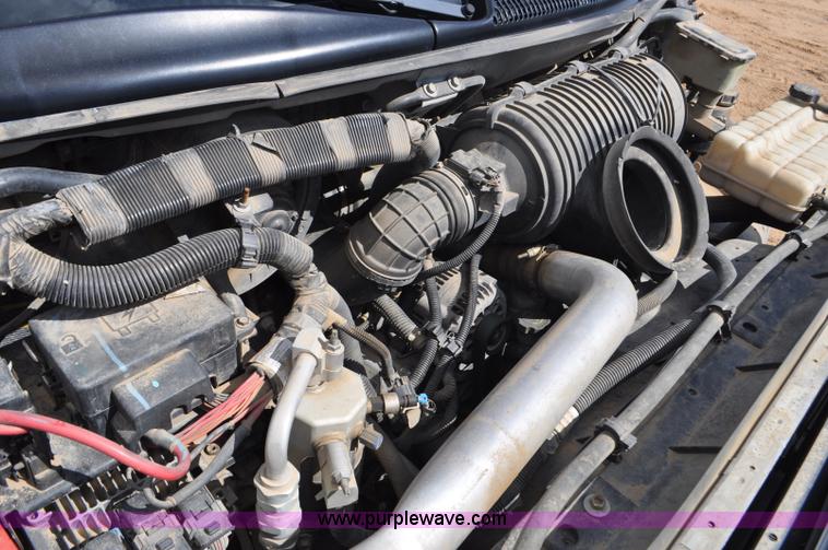 image for item F2349 2004 GMC C4500 flatbed truck