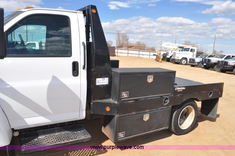 image for item F2349 2004 GMC C4500 flatbed truck