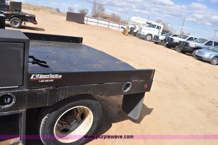 image for item F2349 2004 GMC C4500 flatbed truck