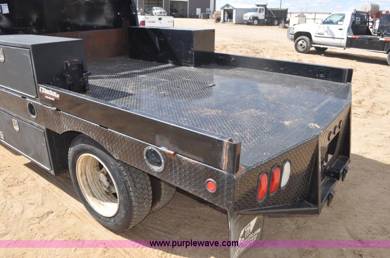 image for item F2349 2004 GMC C4500 flatbed truck