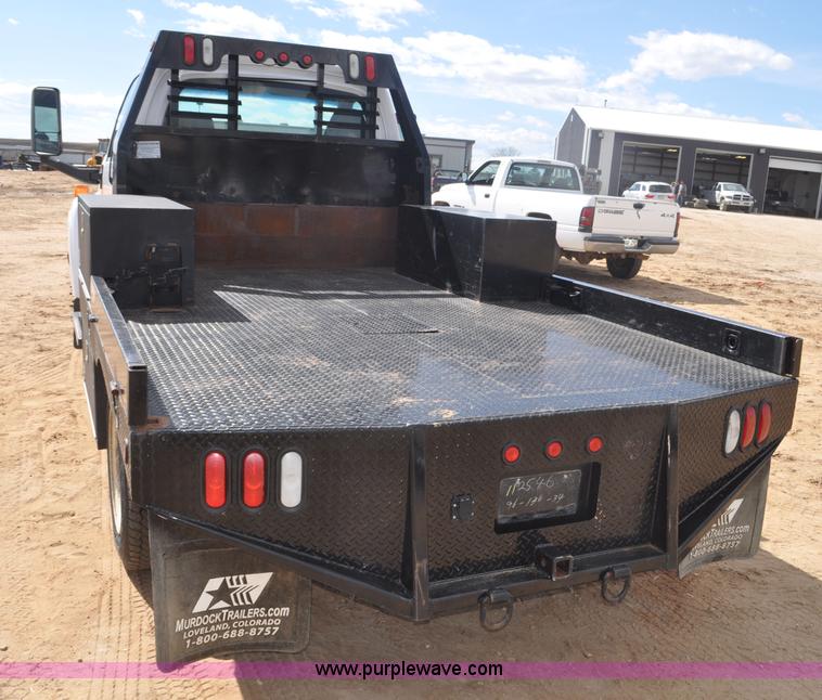 image for item F2349 2004 GMC C4500 flatbed truck