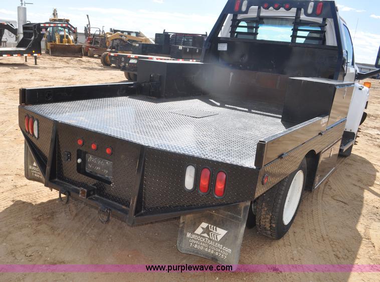 image for item F2349 2004 GMC C4500 flatbed truck