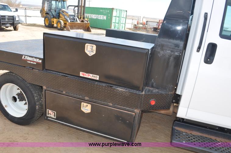 image for item F2349 2004 GMC C4500 flatbed truck