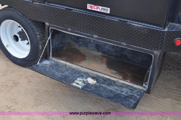image for item F2349 2004 GMC C4500 flatbed truck
