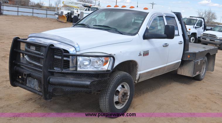 image for item F2352 2007 Dodge Ram 3500 Quad Cab flatbed truck